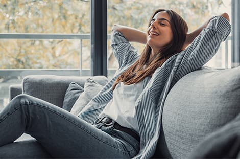 Marcy relaxing on a sofa